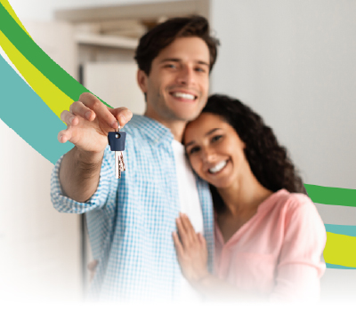 Couple with keys to their house